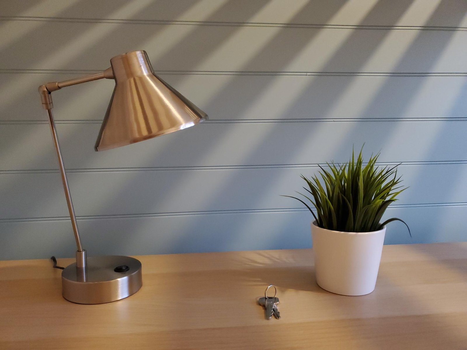 Desk lamp and plant in a furnished 3012 Stays room in Beeston